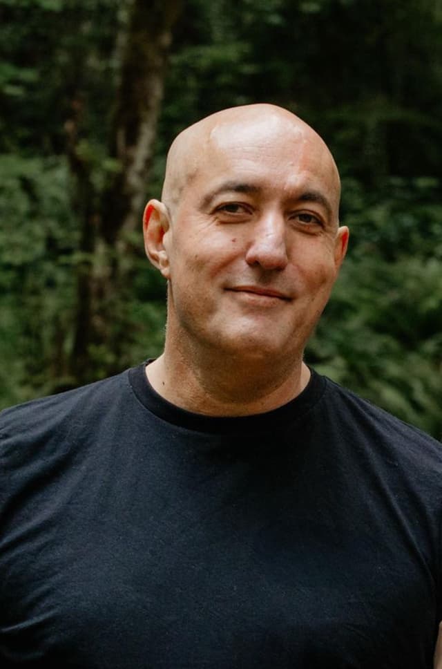 Roy Castleman outdoors, relaxed and confident